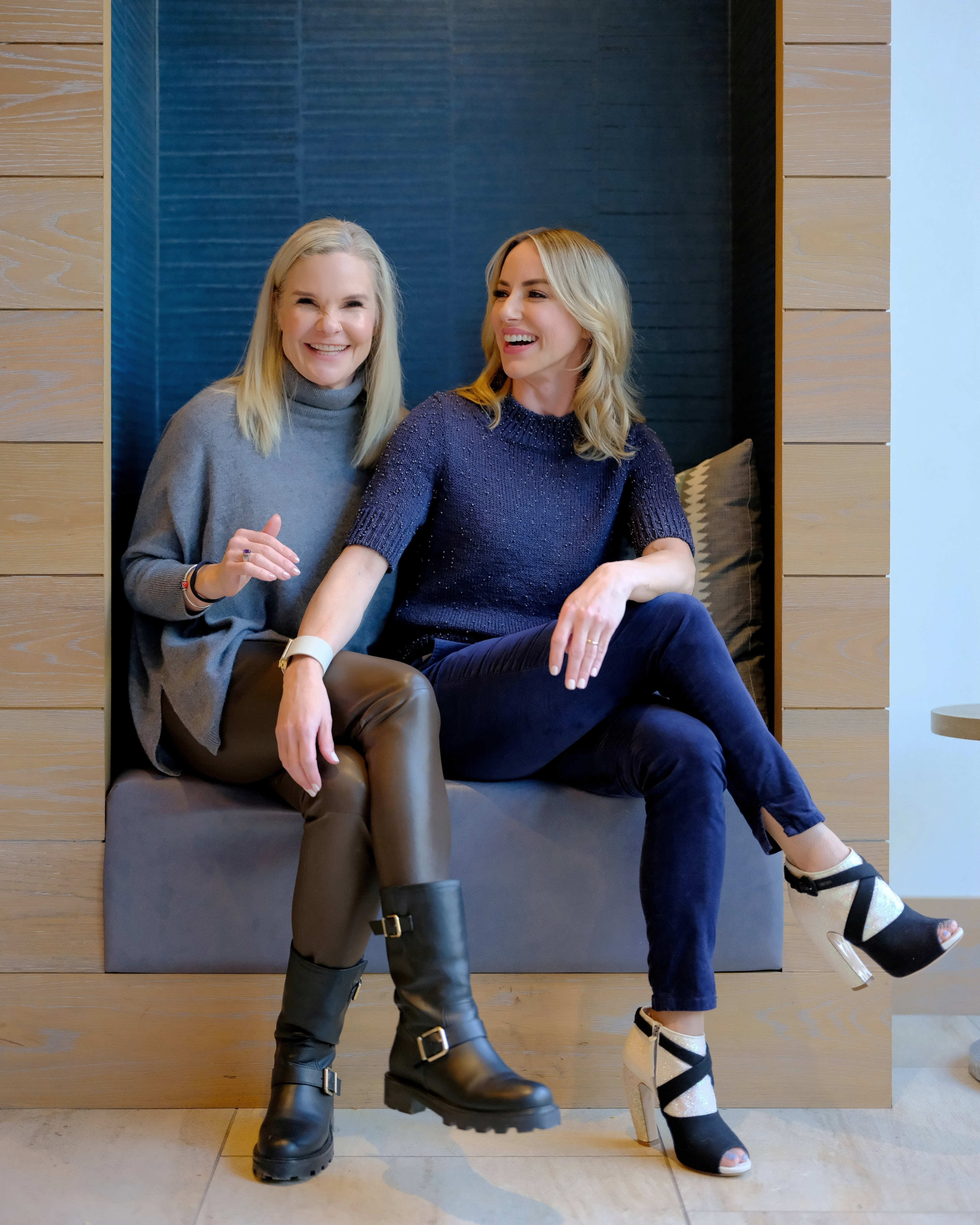 Dierdre Slavin, founder- ceo, and Dr. Wendi Harper Lonabough sharing a boisterous laugh, showcasing genuine connection, joy, and authenticity in the medical aesthetics industry.