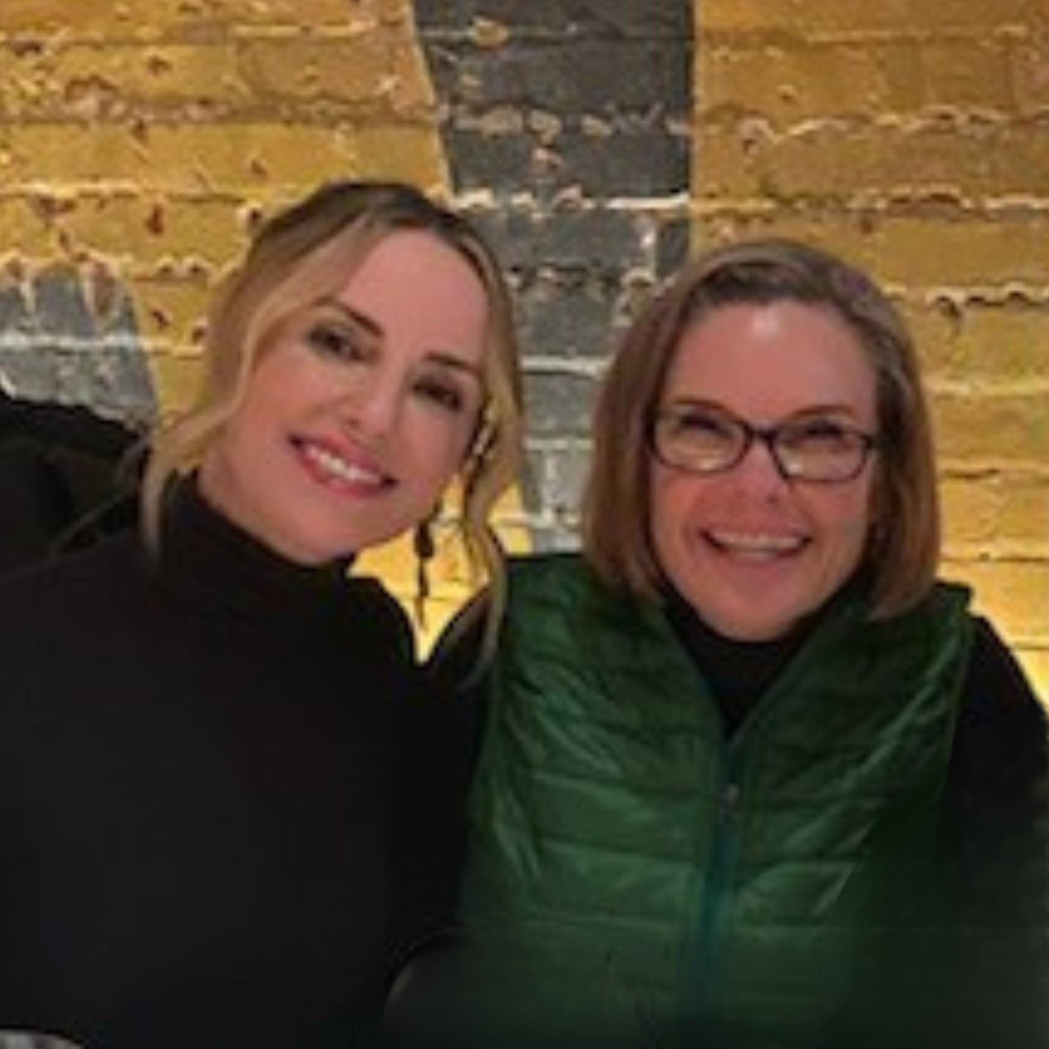 Dierdre Slavin, founder and CEO of Heddy, and Dr. Wendi Harper Lonabough sitting together in a modern lounge, showcasing leadership and expertise in medical aesthetics training.