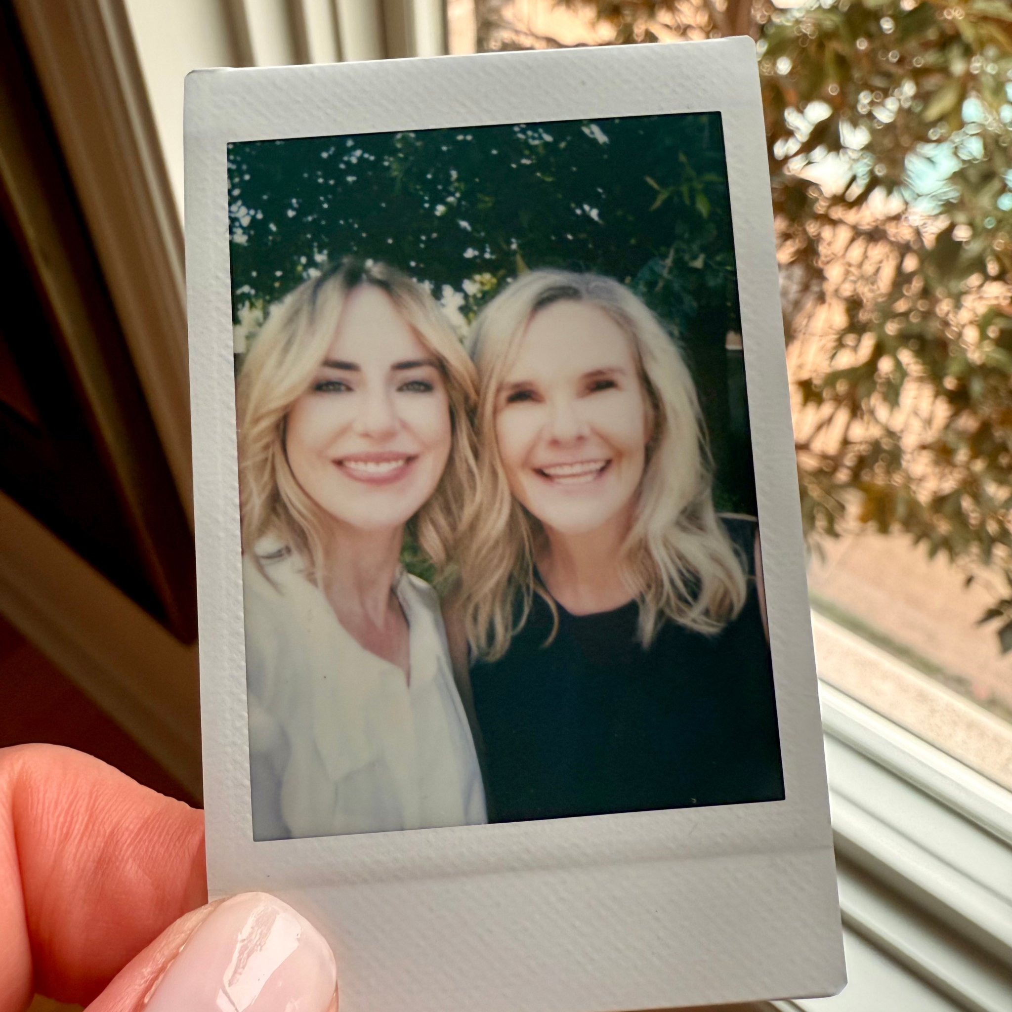 Polaroid photo of Dierdre Slavin and Dr. Wendi Harper Lonabough in 2024, celebrating nearly a decade of friendship and collaboration in medical aesthetics.