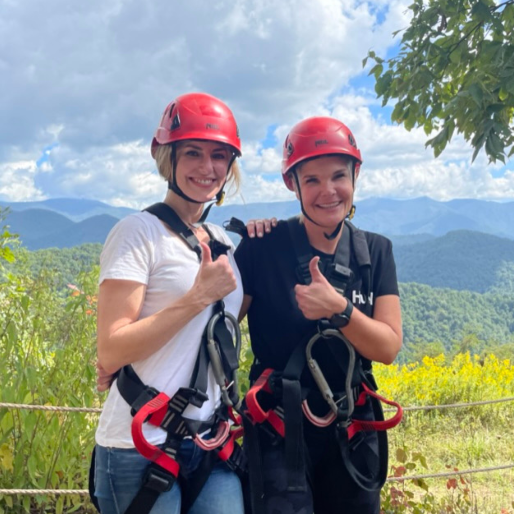 Dierdre Slavin and Dr. Wendi Harper Lonabough zip-lining together in 2021, celebrating their partnership in medical aesthetics and adventure in learning.
