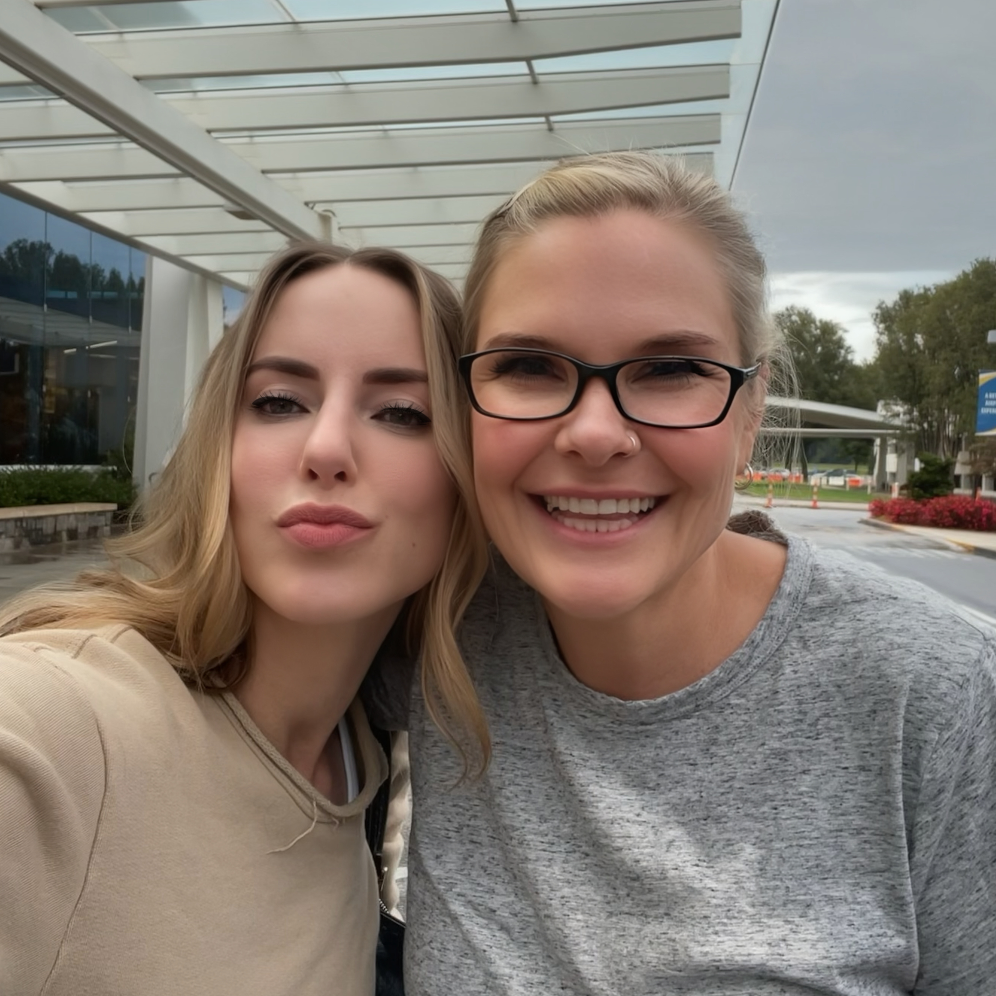 Founder & Ceo, Dierdre Slavin and Dr. Wendi Harper Lonabough smiling together outside in 2022, capturing their long-standing friendship and collaboration in medical aesthetics.