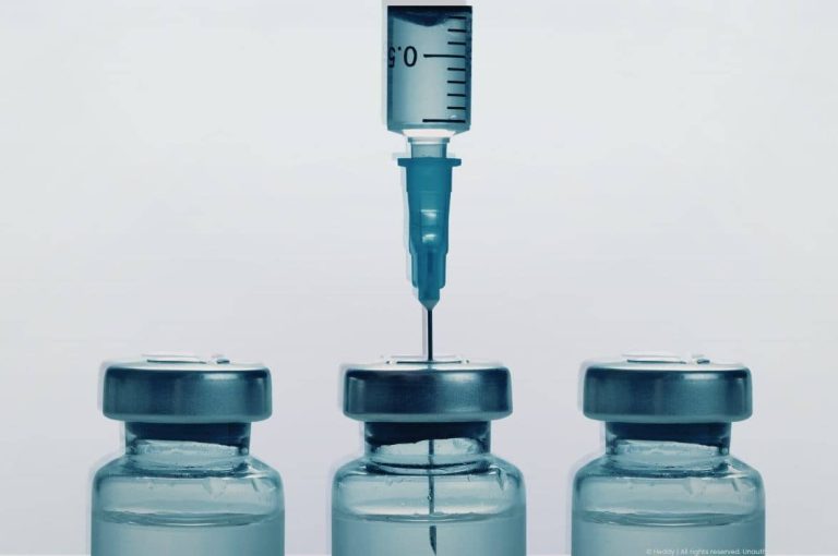 Close-up image of a syringe injecting into medical vials, symbolizing injectable treatments and the rising demand for medical aesthetics driven by GLP-1 weight loss therapies and post-weight-loss facial and skin concerns.